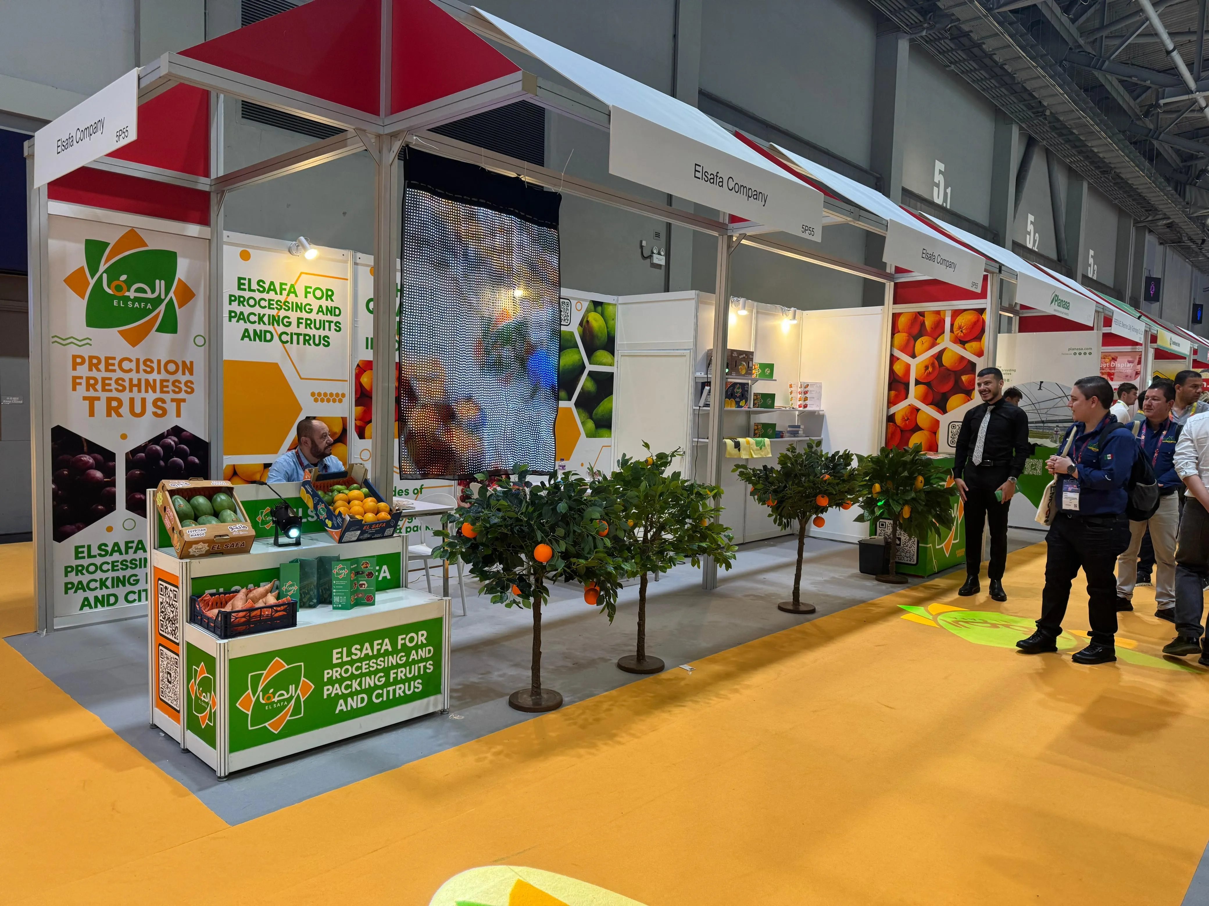 El-Safa booth with visitors and team